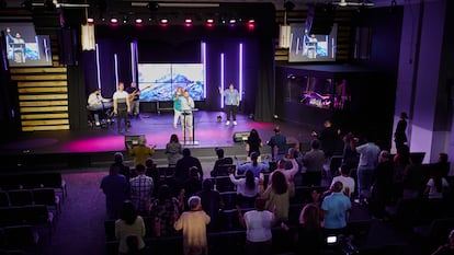 Pastor Jaro Medina in front of members of his congregation at a service on Sunday, April 14 in Chicago.